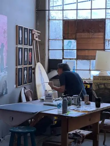Artist at work, lost in the creative flow.